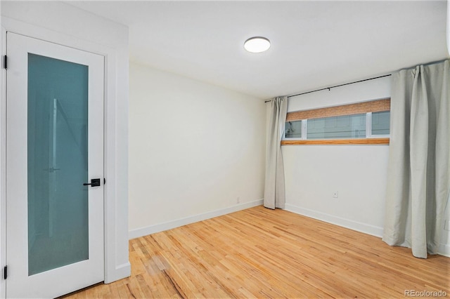 1111 Monroe St, Denver, CO 80206 - spare room featuring wood finished floors and baseboards