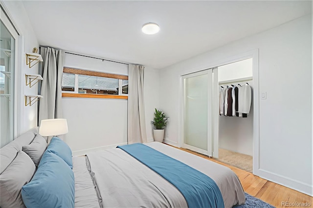 1111 Monroe St, Denver, CO 80206 - bedroom featuring wood finished floors, baseboards, and a closet