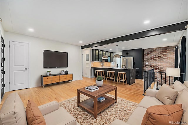 1111 Monroe St, Denver, CO 80206 - living area with light wood-style flooring, recessed lighting, and baseboards