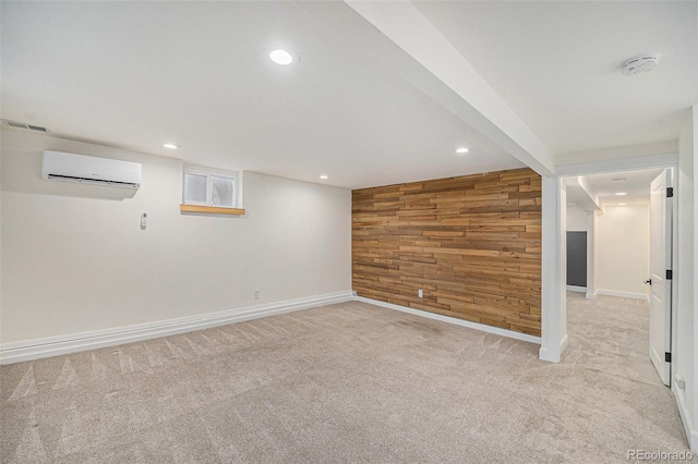 1111 Monroe St, Denver, CO 80206 - finished basement featuring wood walls, light carpet, baseboards, recessed lighting, and a wall unit AC
