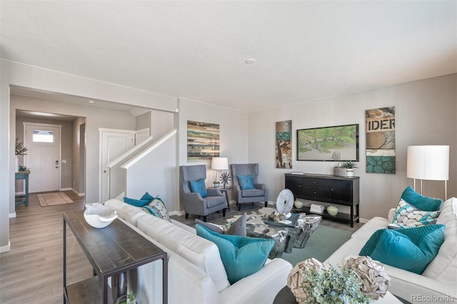 18150 Coppermallow Trl, Parker, CO 80134 - living room with light wood-type flooring and stairway