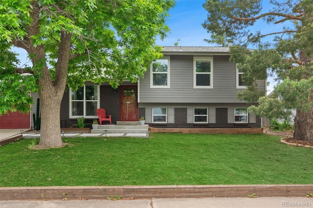 8764 W 95th Ave, Broomfield, CO 80021 - split level home featuring a front lawn, brick siding, and a garage