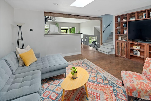 8764 W 95th Ave, Broomfield, CO 80021 - living room featuring wood finished floors, a skylight, and stairway