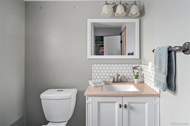 8764 W 95th Ave, Broomfield, CO 80021 - half bath with toilet, vanity, and decorative backsplash