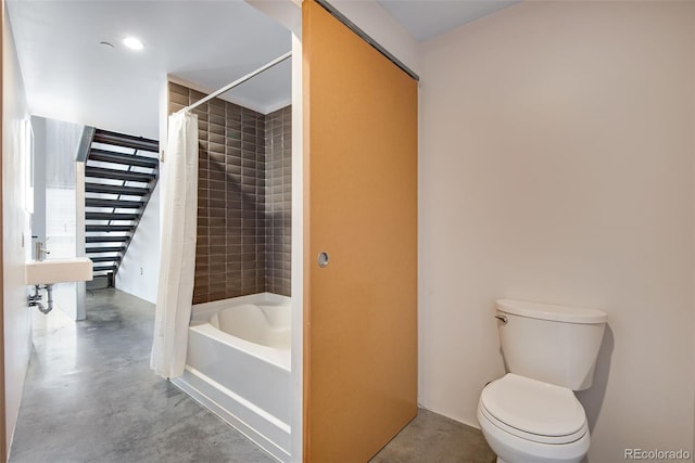 bathroom featuring concrete floors, toilet, and shower / bath combo