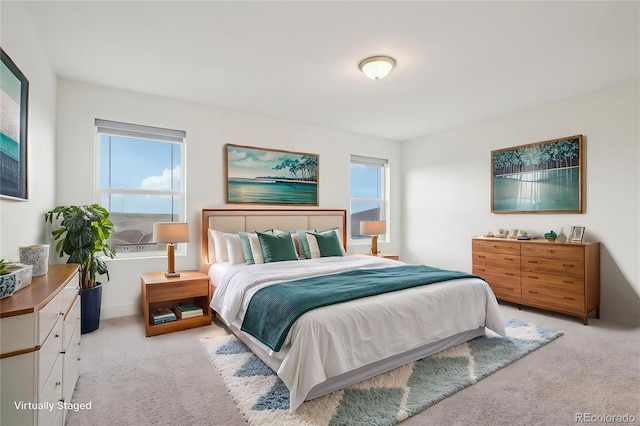 bedroom with light colored carpet