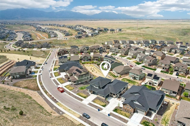 bird's eye view with a residential view and a mountain view
