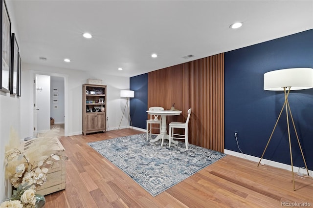 dining area with baseboards, wood finished floors, visible vents, and recessed lighting