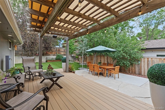 deck featuring a yard and a pergola