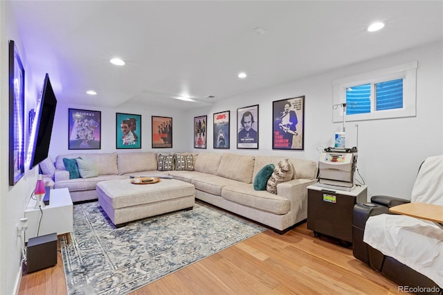 living room featuring light wood finished floors and recessed lighting