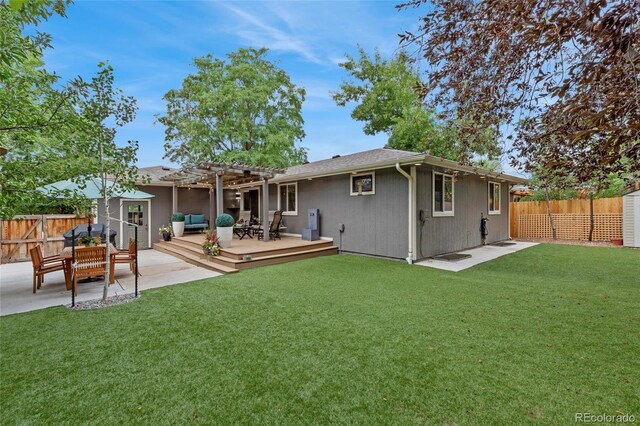 rear view of property featuring an outdoor hangout area, a pergola, a lawn, and a wooden deck