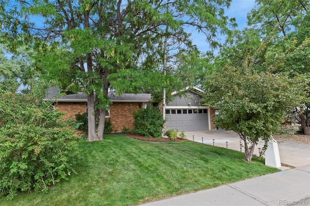 view of front of home featuring a garage and a front lawn