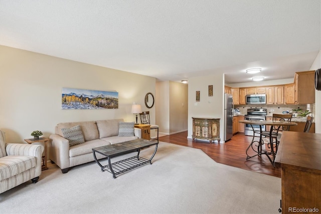 living area featuring light wood finished floors and baseboards