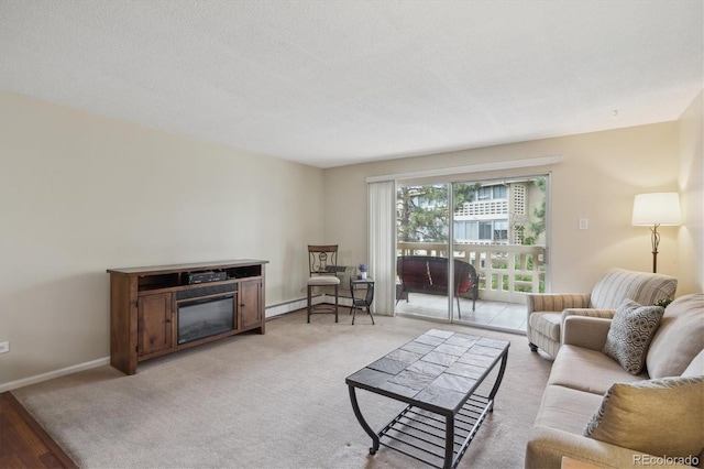 living area featuring baseboard heating, baseboards, and a textured ceiling