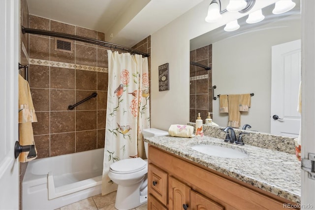bathroom with tile patterned floors, toilet, vanity, and shower / bath combo