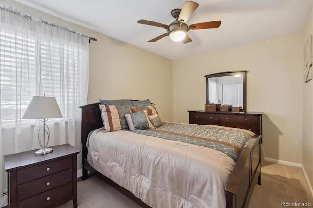 bedroom featuring carpet flooring, baseboards, and ceiling fan
