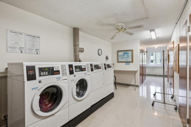 shared laundry room with washing machine and dryer, a ceiling fan, a textured ceiling, and baseboards