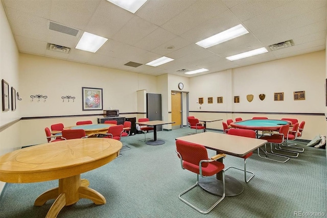 game room featuring carpet floors and a paneled ceiling