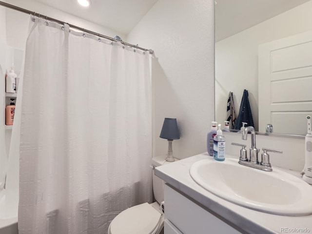 bathroom with vanity, toilet, and walk in shower