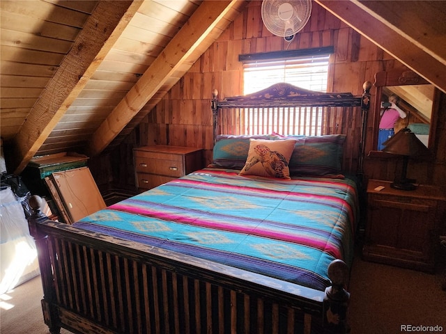 bedroom featuring carpet flooring, vaulted ceiling with beams, and wood ceiling