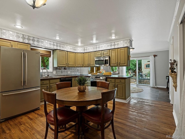 109 Bear Creek Ln, Morrison, CO 80465 - dining area with ornamental molding, healthy amount of natural light, dark wood finished floors, and recessed lighting