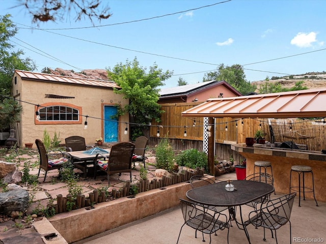 109 Bear Creek Ln, Morrison, CO 80465 - fenced backyard with an outdoor fire pit and a patio