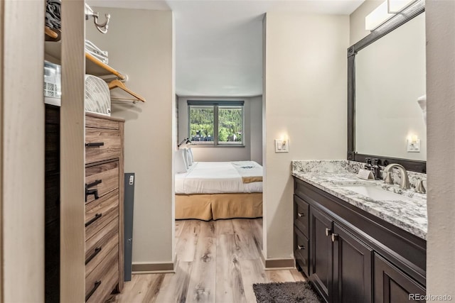 bathroom featuring vanity and hardwood / wood-style flooring