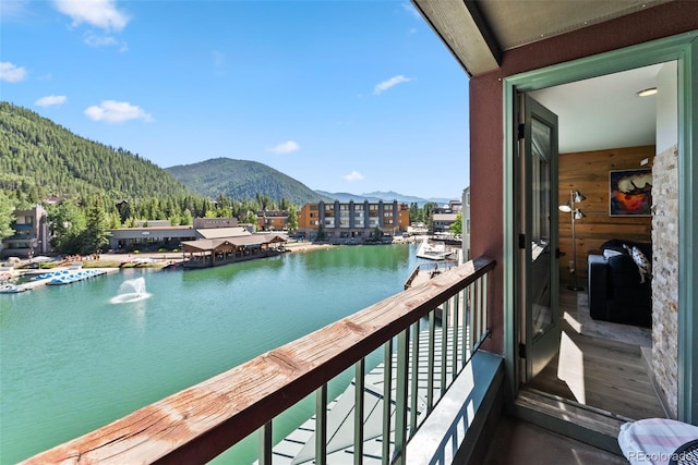 balcony with a water and mountain view