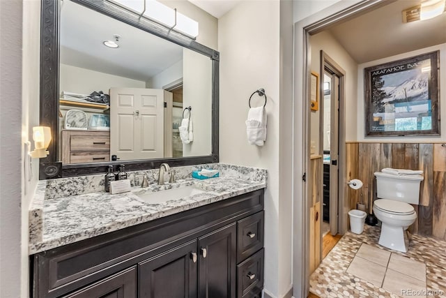 22174 US Highway 6 Unit 1535, Dillon, CO 80435 - bathroom with vanity, toilet, and wainscoting