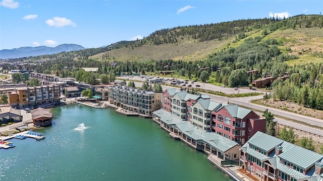 aerial view featuring a water and mountain view