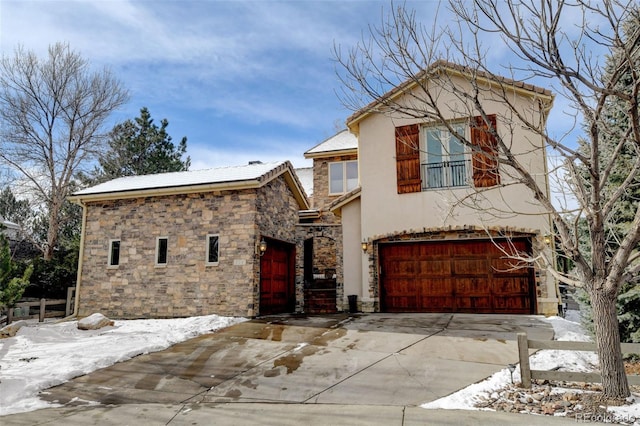 view of front facade featuring concrete driveway and stucco siding