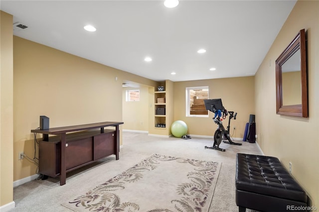 exercise room with light colored carpet, visible vents, baseboards, and recessed lighting