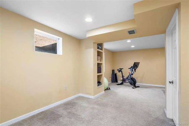 exercise room featuring baseboards, recessed lighting, visible vents, and light colored carpet