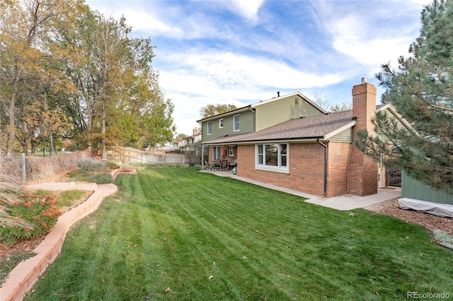 view of yard featuring a patio and a fenced backyard