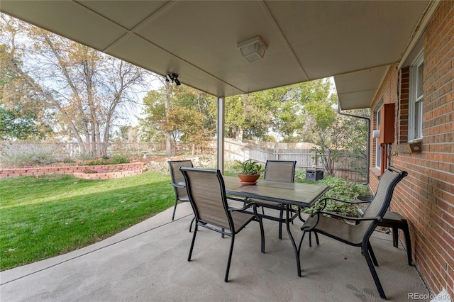 view of patio with a fenced backyard and outdoor dining area