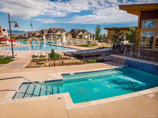 1039 Highview Dr, Erie, CO 80516 - community pool featuring a patio area