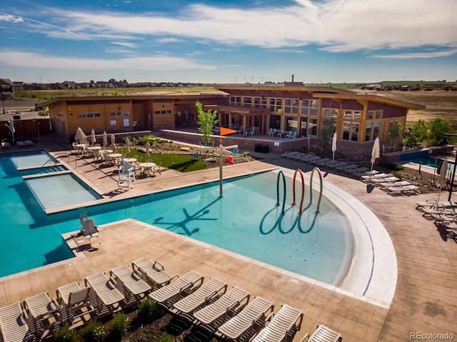 1039 Highview Dr, Erie, CO 80516 - community pool featuring a patio area