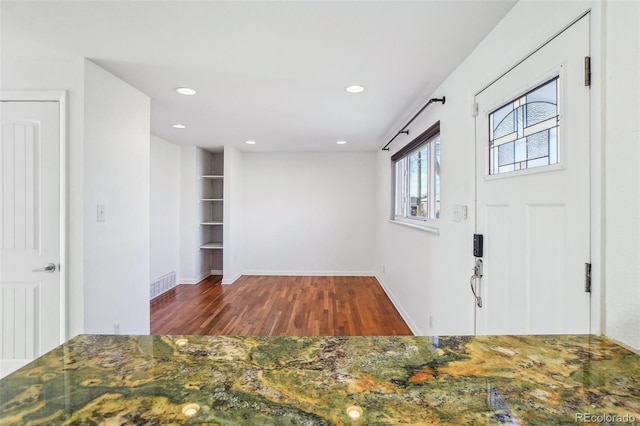 foyer entrance with dark wood-type flooring