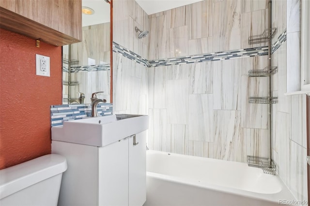 full bathroom featuring vanity,  shower combination, and toilet