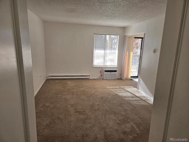 unfurnished room with carpet flooring, a textured ceiling, baseboard heating, and a wall mounted air conditioner