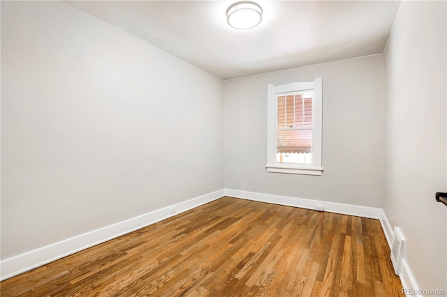 unfurnished room featuring wood-type flooring