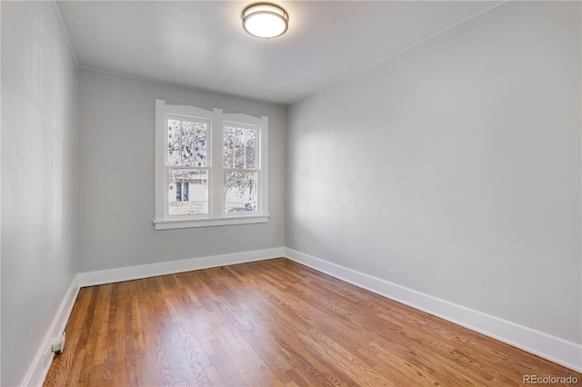 empty room featuring wood-type flooring