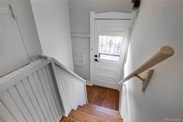 stairway featuring hardwood / wood-style floors