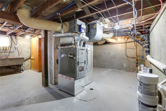 utility room with heating unit