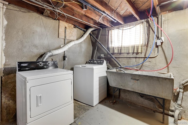 laundry area featuring independent washer and dryer and sink