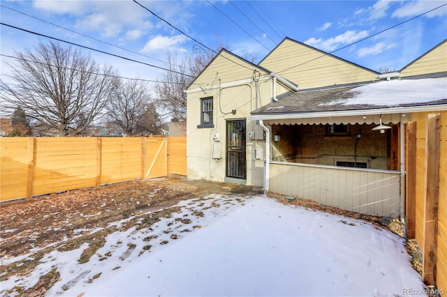 view of snow covered house