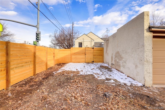 view of yard layered in snow