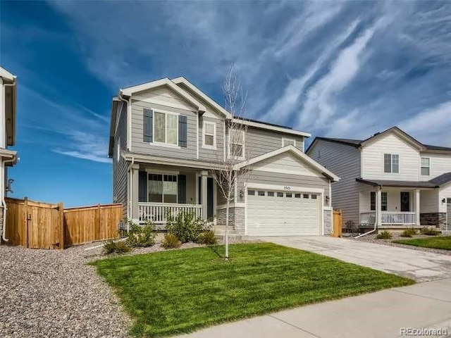 view of front of house with a porch, a garage, and a front lawn