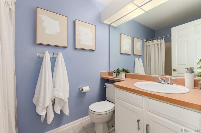 bathroom featuring toilet, vanity, tile patterned flooring, and curtained shower