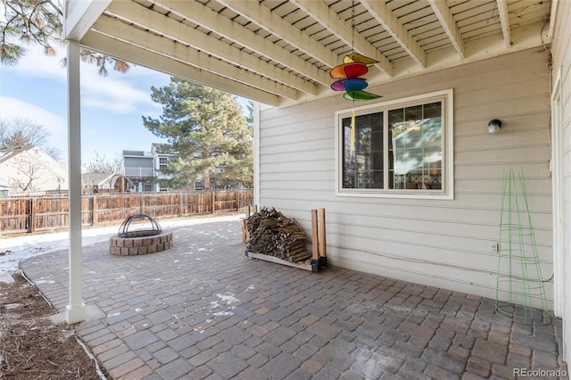 view of patio / terrace with ceiling fan and an outdoor fire pit